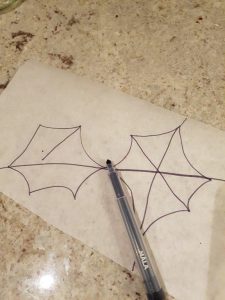 Tegning av spindelvev på matpapir. Foto