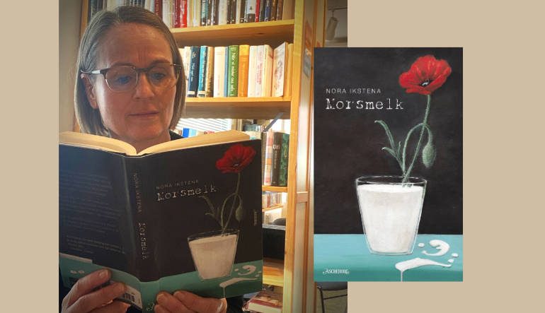 Enav bibliotekets ansatte står foran en bokhylle. Hun leser i boka Morsmelk.